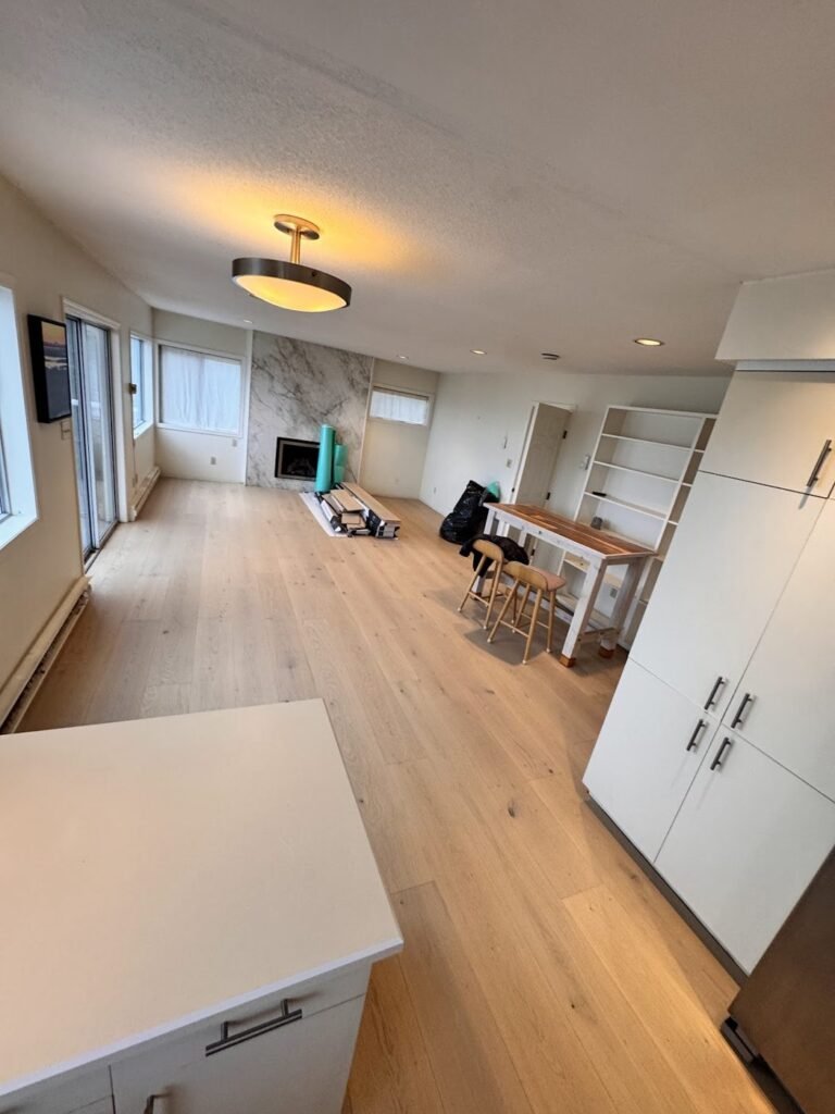 Bright open living space with fresh plank flooring - Pi Floor & Blinds Victoria BC