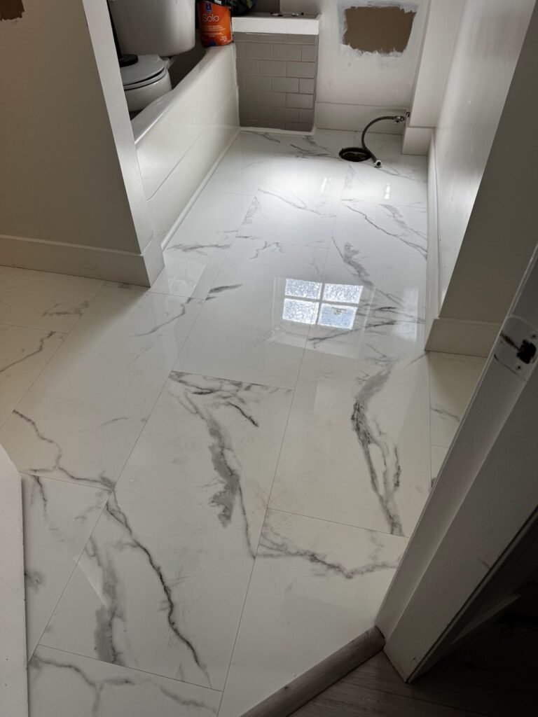Marble-look flooring in an entry or bathroom - Pi Floor & Blinds Victoria BC