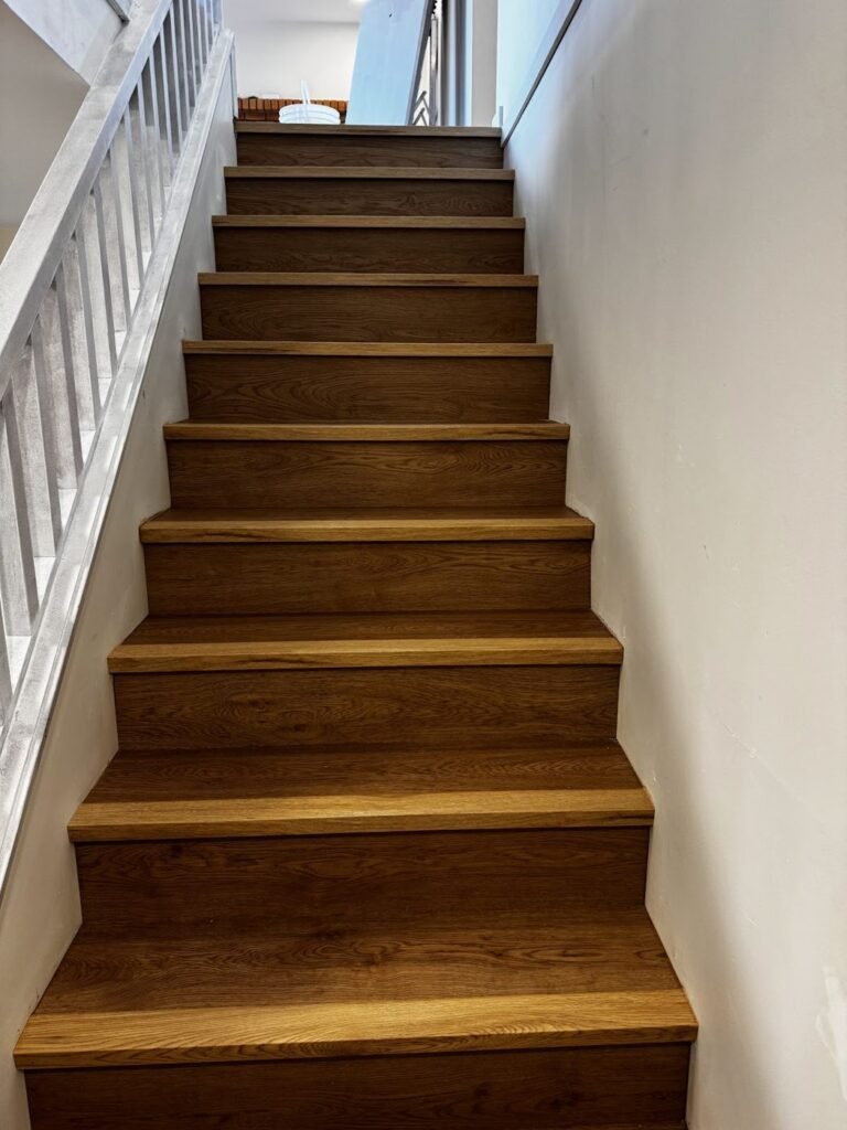 Full staircase with rich brown wood treads - Pi Floor & Blinds Victoria BC